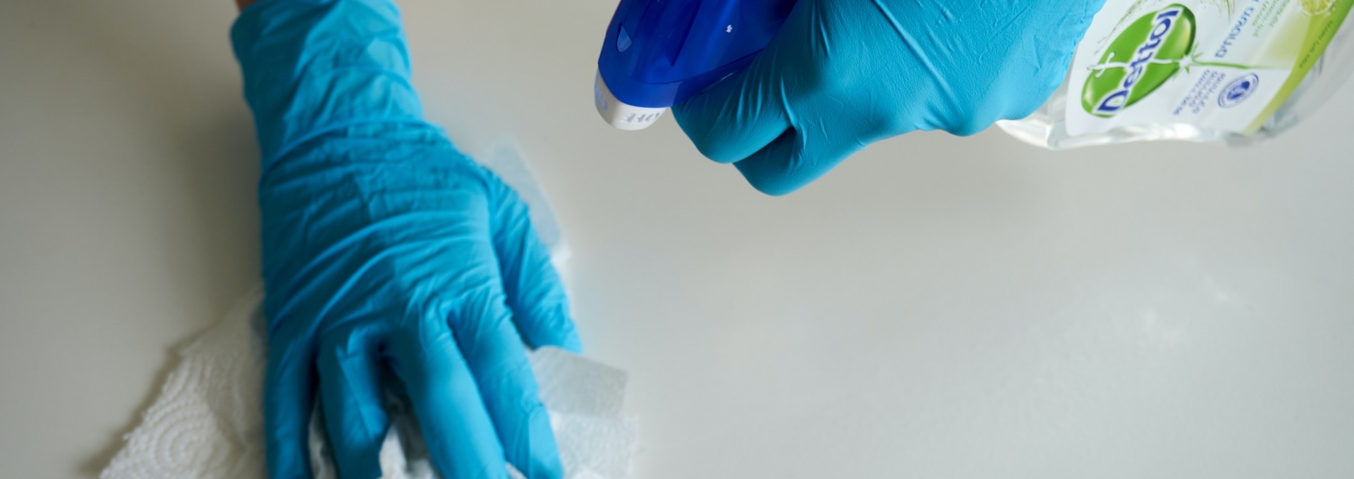 Employees wearing gloves uses disinfectant