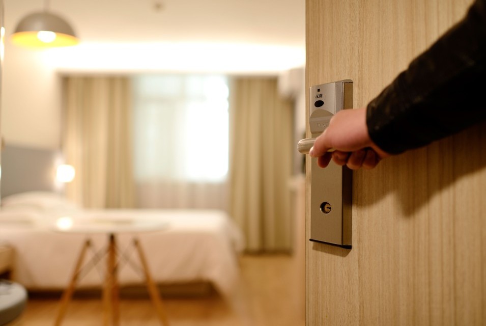 Door opens to a guest room.