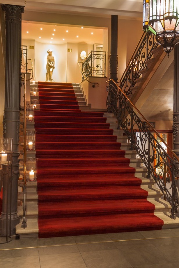 Staircase lit with candles in the entrance area of the Hotel Halm.