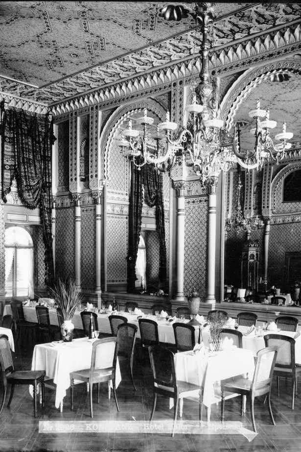 Historical black and white photo of the Moorish Hall with chandeliers.