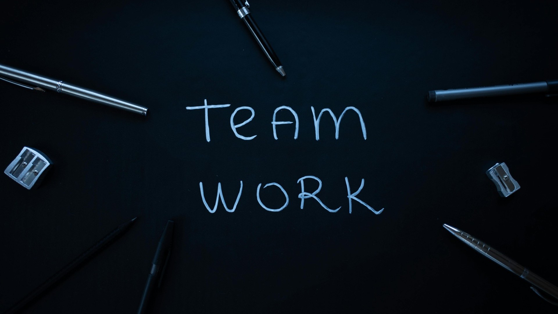 “Teamwork” written on a chalkboard
