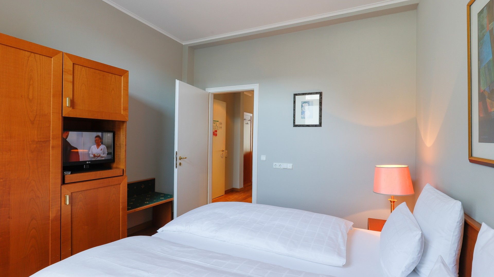 Classic suite at Hotel Halm Constance with separate living and sleeping areas.